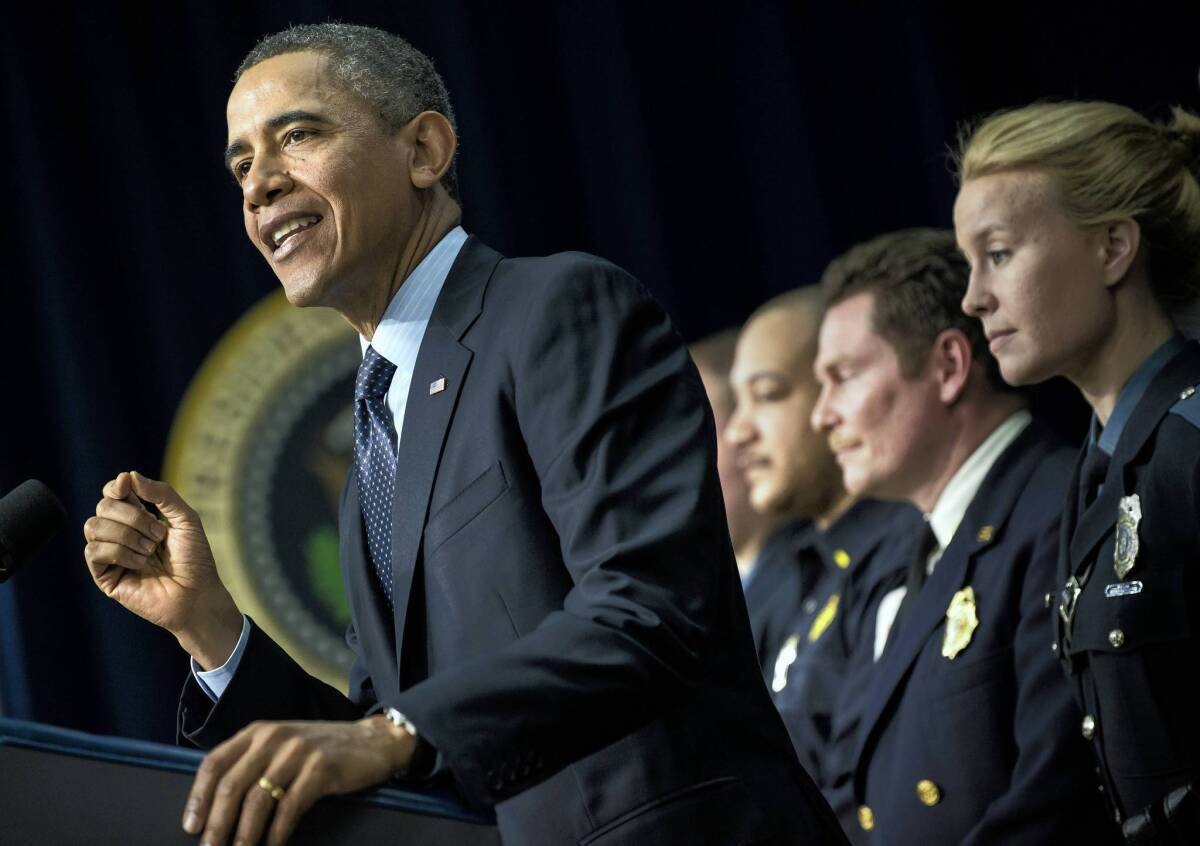 President Obama appears at the White House with firefighters and police officers, who are among those who would be affected if scheduled spending cuts go into effect March 1. "These cuts are not smart. They are not fair. They will hurt our economy," Obama said.