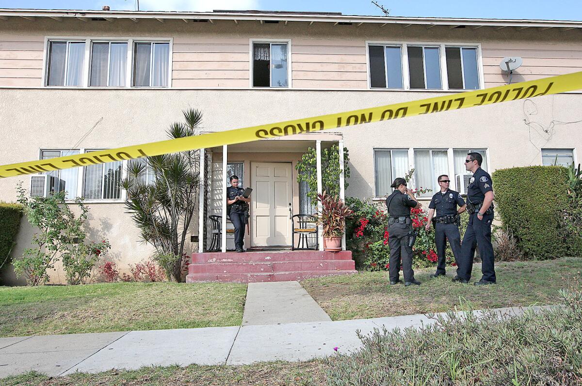 Glendale police investigate the scene of a homicide at 1830 Irving Ave. on Monday, November 18, 2013.