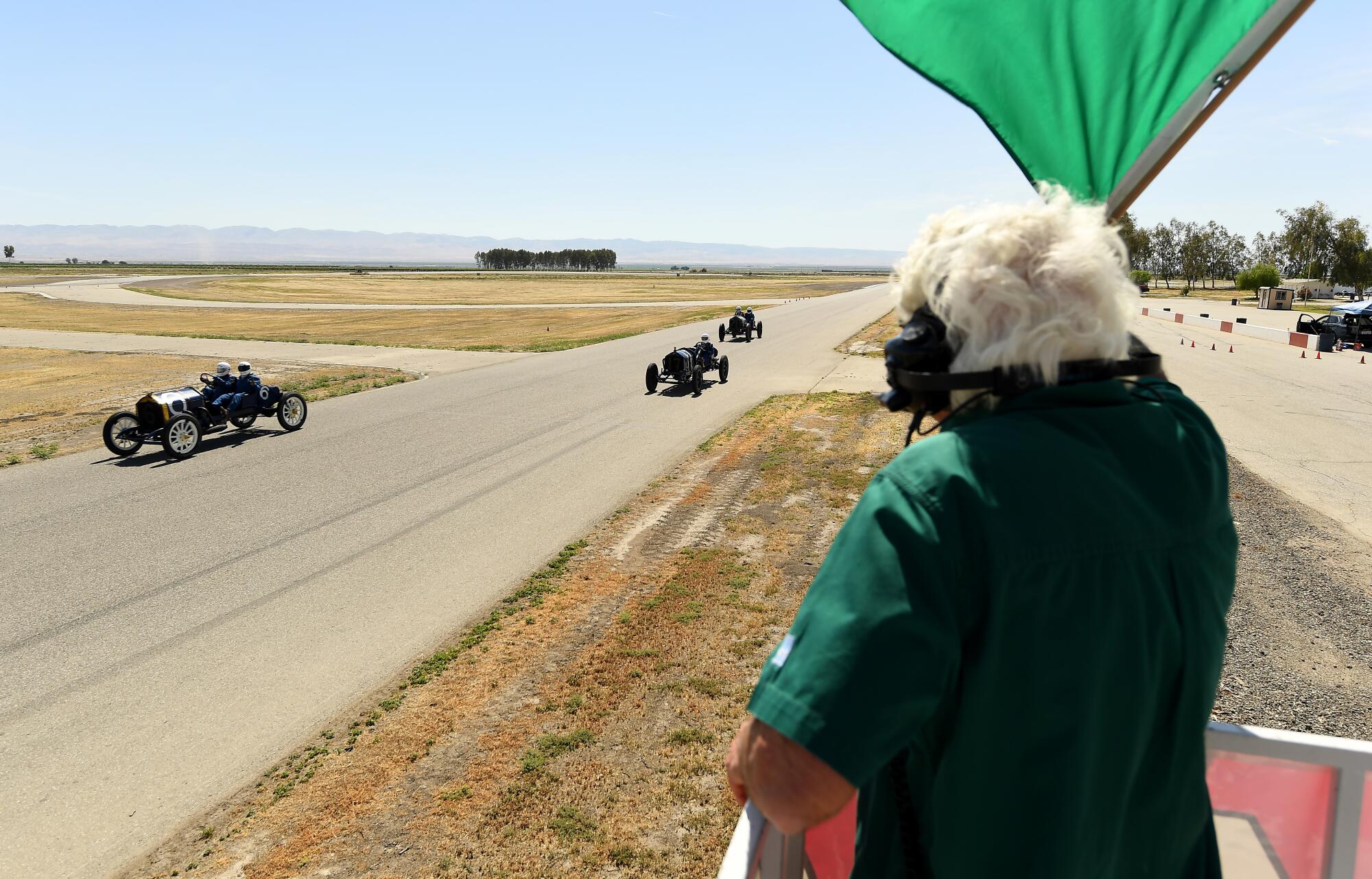Vintage race car drivers get the green flag during a race at Buttonwillow Raceway in Buttonwillow, Calif., on Saturday.