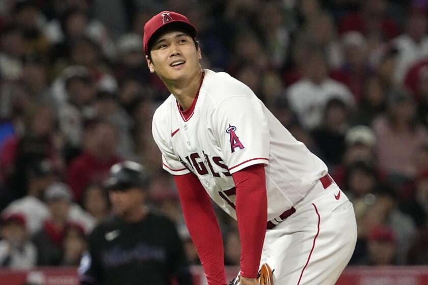 Los Angeles Angels starting pitcher Shohei Ohtani reacts after a ball was called on one of his pitches.