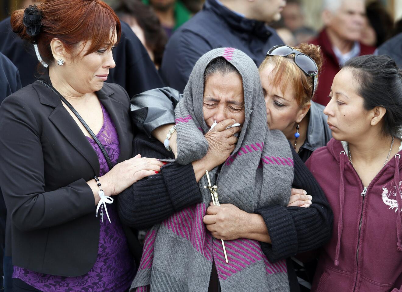 Agapita Montes Rivera is comforted after the funeral for her son, Antonio Zambano Montes, in Pasco, Wash. His shooting death by police has sparked protests and calls for a federal investigation.