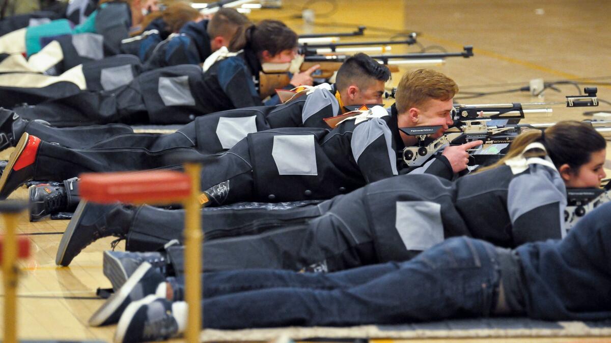 JROTC shooters compete in the prone position during the 2018 New Mexico Junior Olympics qualifier for sport and precision air rifles at Cibola High School in Albuquerque on March 2.