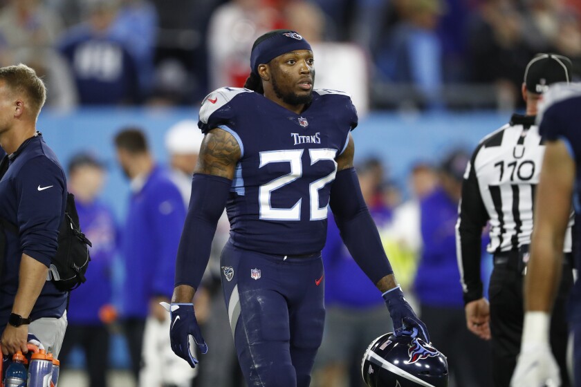 FILE - Tennessee Titans running back Derrick Henry walks on the sideline during an NFL football game against the Buffalo Bills on Monday, Oct. 18, 2021, in Nashville, Tenn. The Titans have moved a step closer to having the 2020 AP NFL Offensive Player of the Year back, opening the 21-day window Wednesday, Jan. 5, 2022, for Derrick Henry to start practicing. (AP Photo/Wade Payne, File)