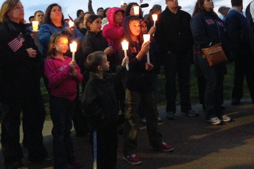 Residents of the Dorchester neighborhood at a candlelight vigil for 8-year-old Martin Richard, who died in the marathon bombing.