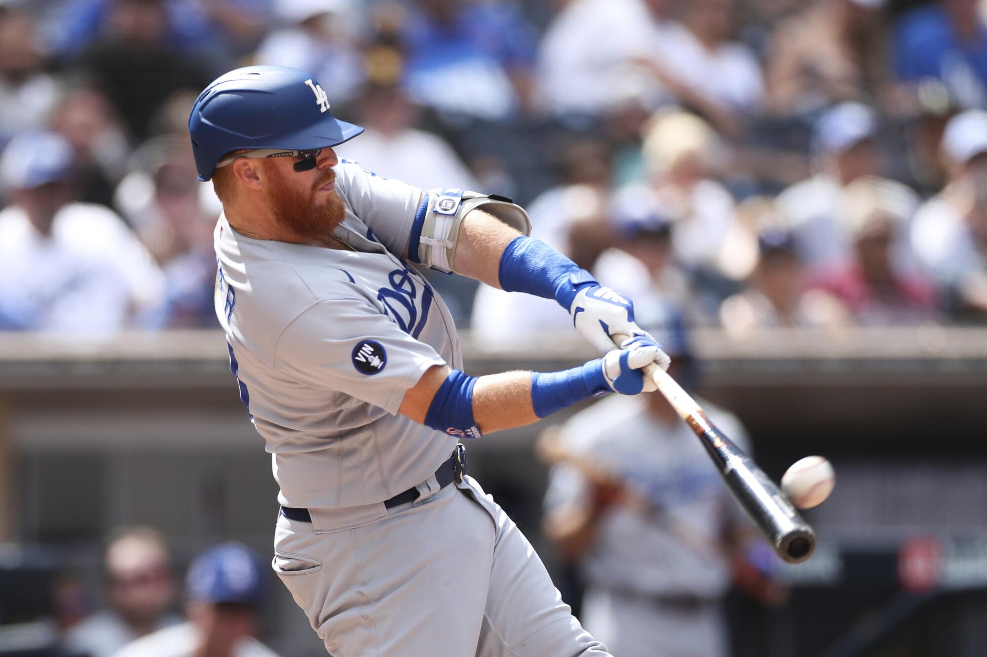 Justin Turner hits a solo home run off San Diego Padres starter Joe Musgrove in the fifth inning Sunday.