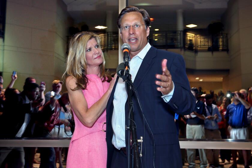 Dave Brat stands his wife, Laura, as he speaks to supporters in Henrico, Va., after defeating Republican Congressman Eric Cantor in the Republican primary for the 7th Congressional District in Virginia on Tuesday.