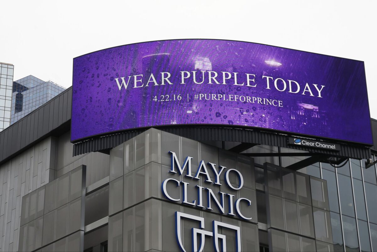 A sign above the Mayo Clinic in Minneapolis, Prince's hometown, asks people to wear purple in memory of the pop superstar. The related hashtag #PurpleForPrince was sweeping social media.
