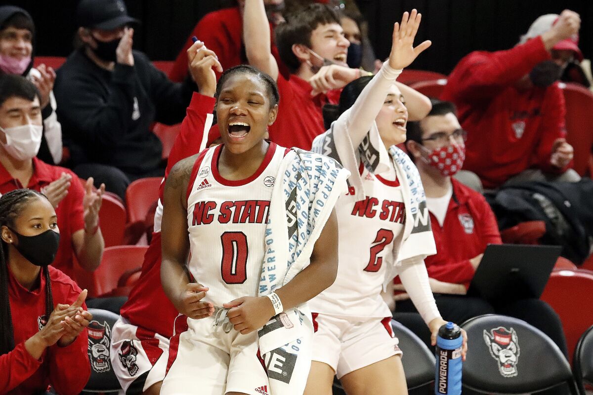 Diamond Johnson (0) starts to celebrate with teammate Raina Perez (2) in the closing minutes of the second half of an NCAA college basketball game against Duke, Sunday, Jan. 16, 2022, in Raleigh, N.C. (AP Photo/Karl B. DeBlaker)