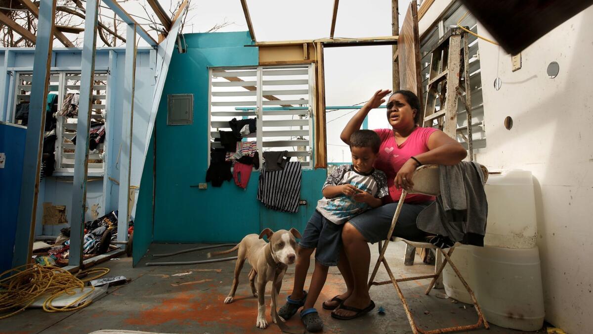 Heydee Perez, age 29, and her son, Yeriel Calera, age 4, in their devastated home in San Isidro, Puerto Rico a week after Hurricane Maria struck the island.