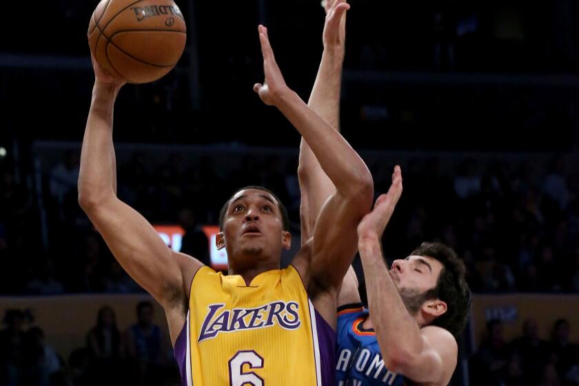 Lakers guard Jordan Clarkson tries to drive to the basket against Thunder guard Alex Abrines in the second quarter on Nov. 22.