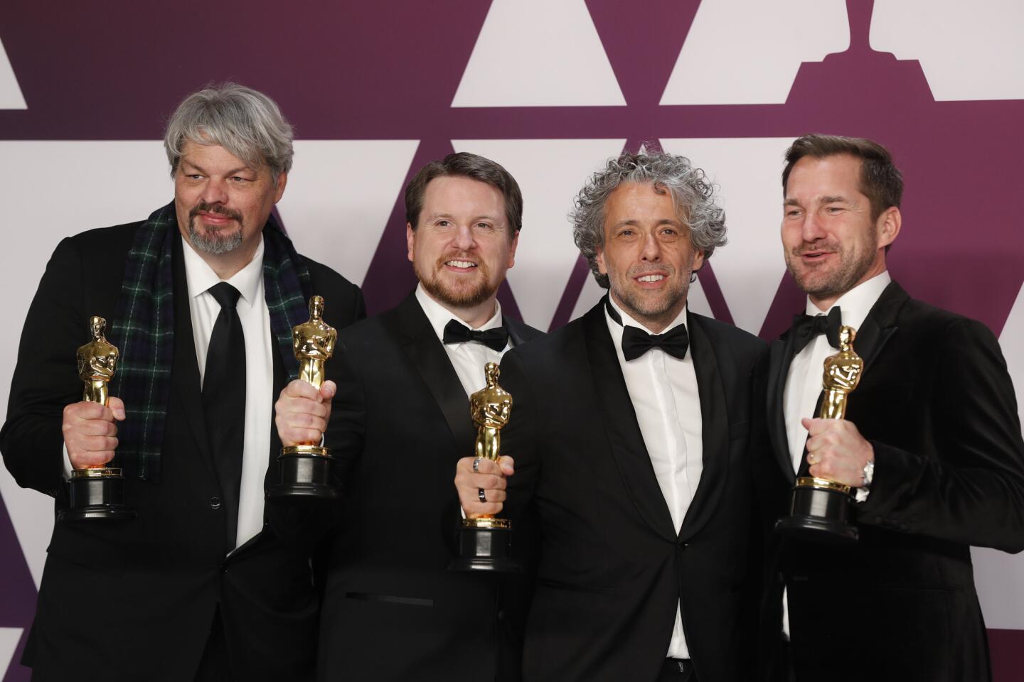 Ian Hunter, Tristan Myles, Paul Lambert and J.D. Schwalm, winners of of the visual effects award for "First Man."
