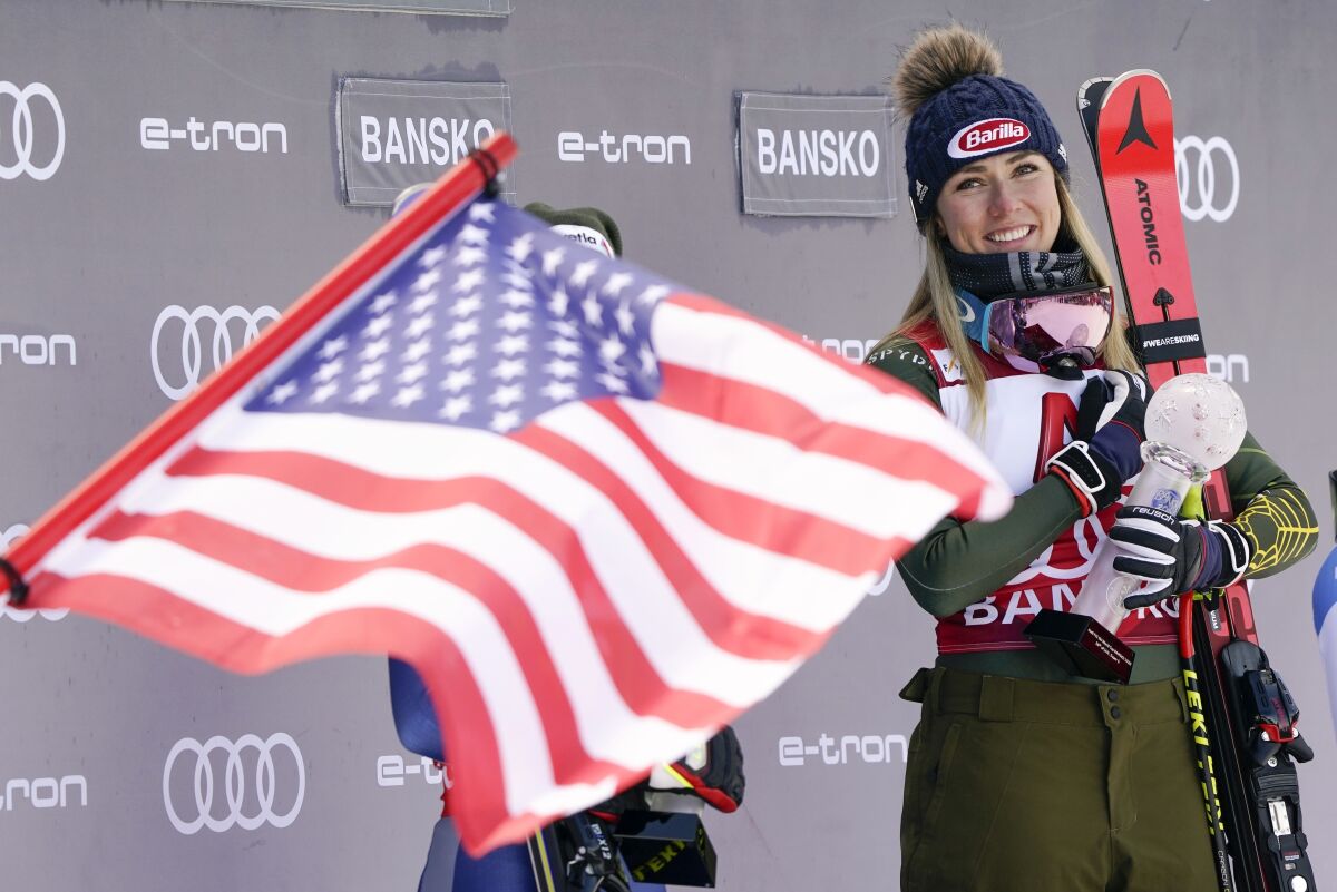 FILE - In this Sunday, Jan. 26, 2020 file photo, United States' Mikaela Shiffrin smiles on the podium after winning the alpine ski, women's World Cup super-G, in Bansko, Bulgaria. A year that turned Mikaela Shiffrin’s world upside-down has left the American standout wondering how much time she has left in ski racing. The double Olympic and three-time overall World Cup champion is questioning how long all the traveling will still be worth it. (AP Photo/Giovanni Auletta, File)