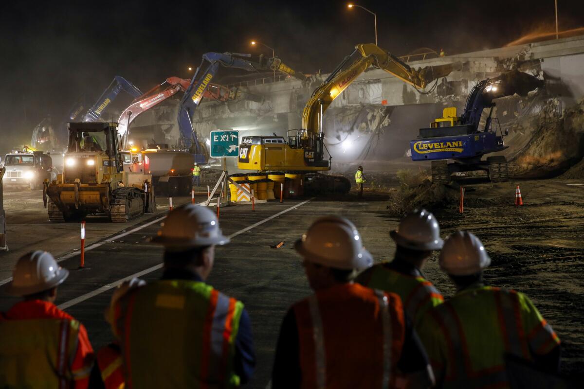 Work crews closed the 405 Freeway in August as they knocked down a portion of an overpass. The closure and road work resumes Saturday night.