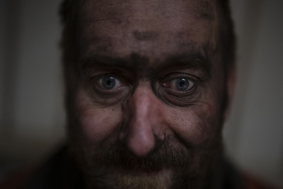 Coal miner Jonny Sandvoll poses for a portrait in the break room of the Gruve 7 coal mine in Adventdalen, Norway, Monday, Jan. 9, 2023. Gruve 7, the last Norwegian mine in one of the fastest warming places on earth, was scheduled to shut down this year and only got a reprieve through 2025 because of the energy crisis driven by the war in Ukraine. Sandvoll said he wished people understood more about coal and its uses before deciding to close the mine. (AP Photo/Daniel Cole)