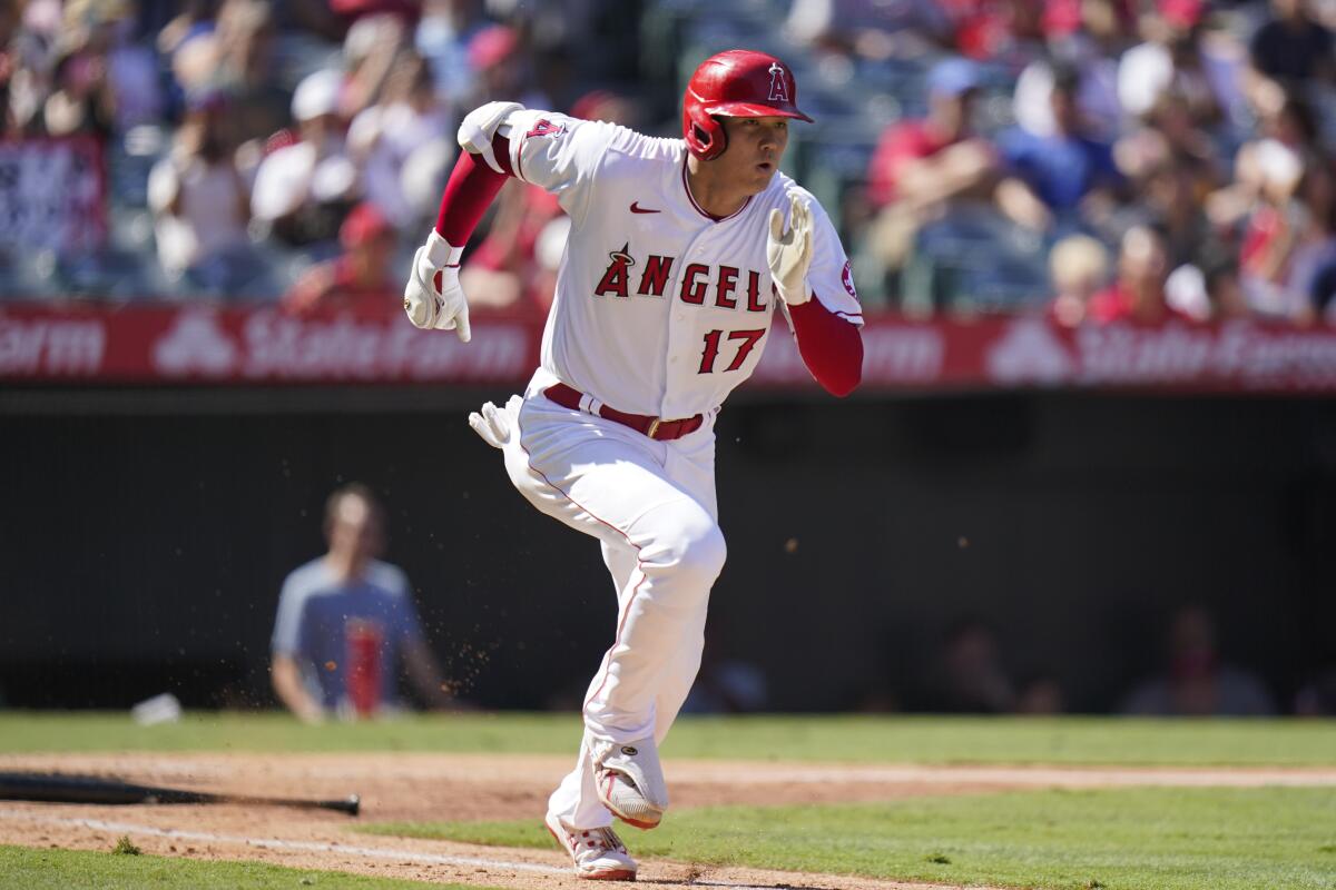 Shohei Ohtani runs to first base during a game.