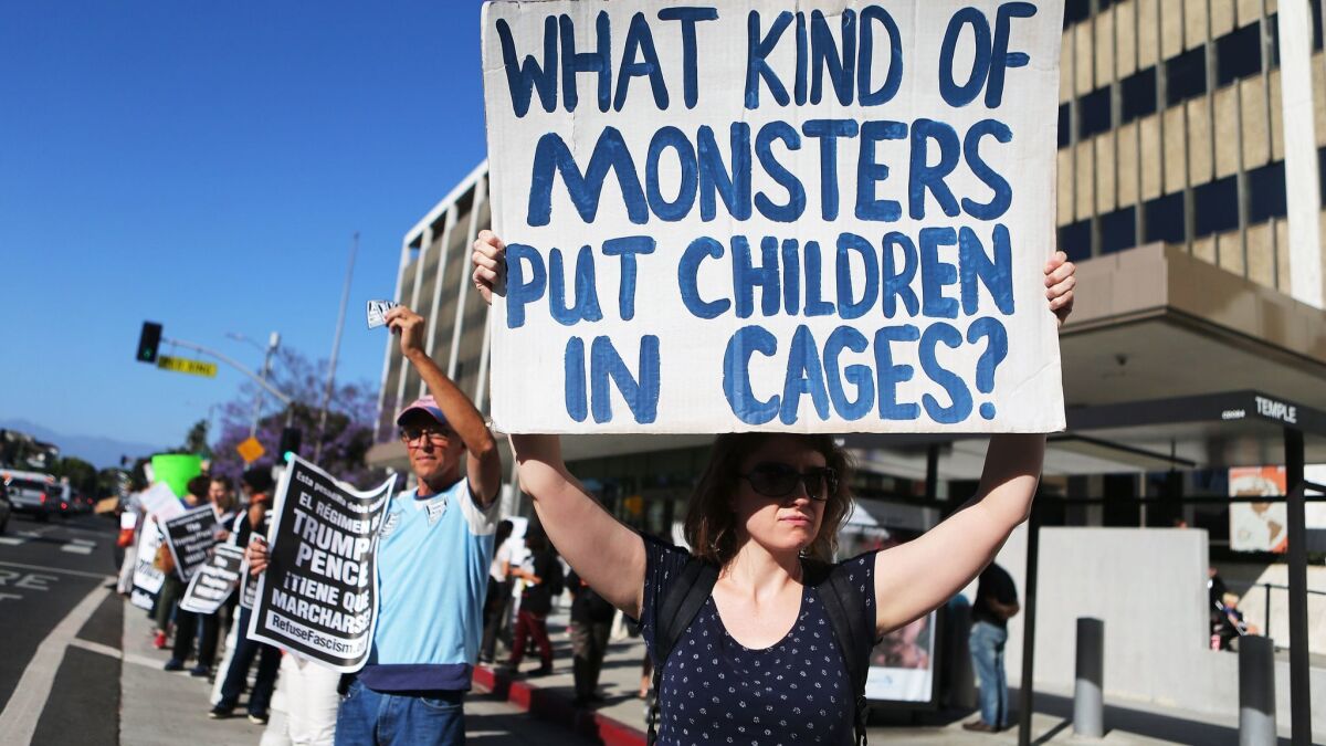 Protesters demonstrate against the separation of migrant children from their families in front of the federal building in downtown Los Angeles on June 18.