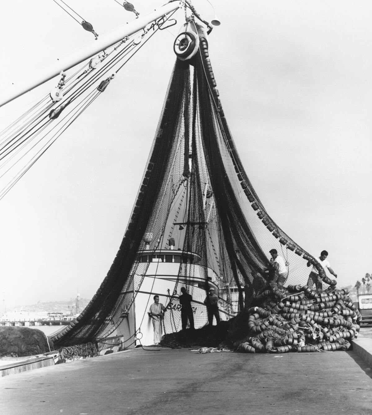 Nets instead of poles became common aboard tuna boats in the 1950s. — -- San Diego History Center