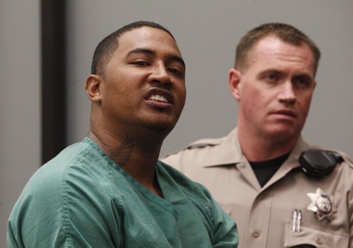 Titus Nathan Colbert, 33, of Las Vegas, is seen at his arraignment Friday on charges of attempting to murder San Diego police who responded to a domestic violence call from Colbert's ex-girlfriend.