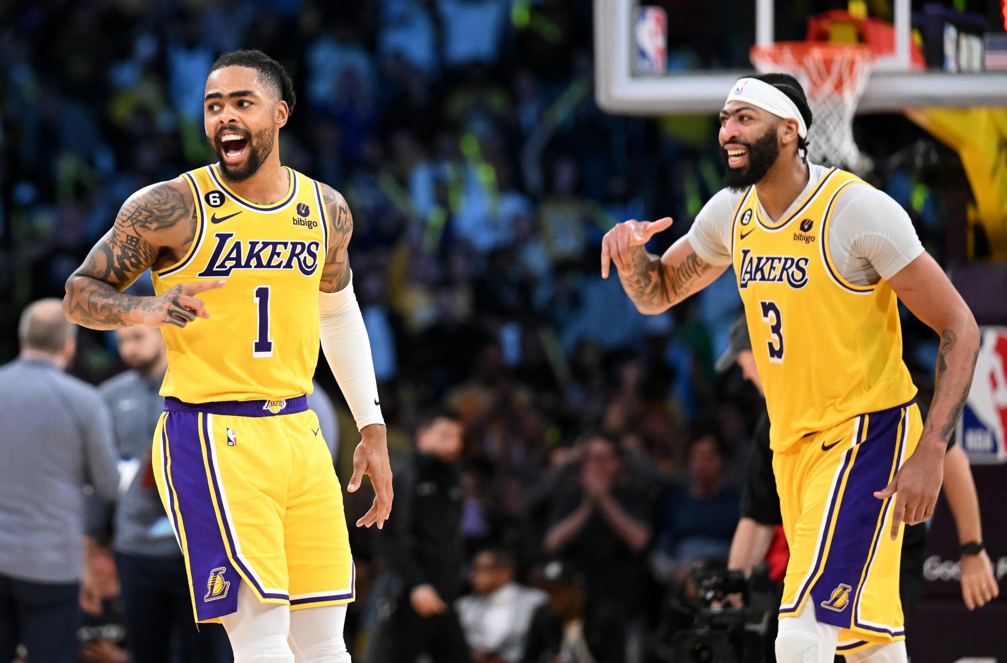 Lakers guard D'Angelo Russell celebrates a three-pointer with forward Anthony Davis.