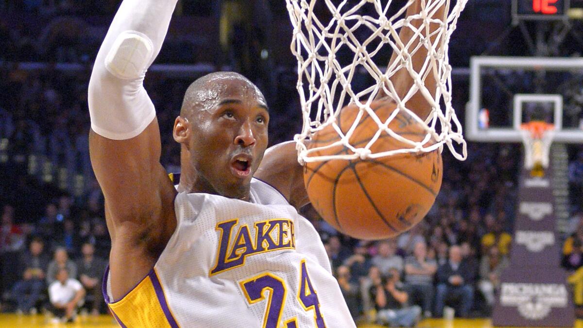 Lakers star Kobe Bryant dunks during a game against Indiana Pacers at Staples Center on Jan. 4.