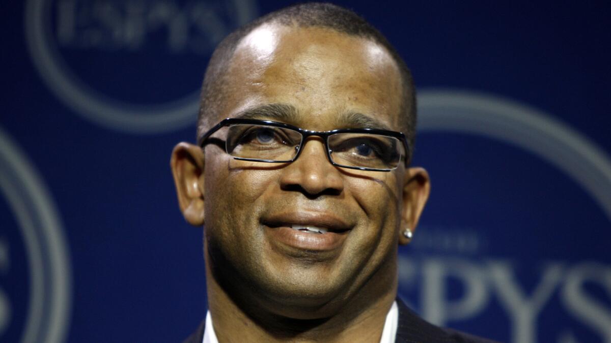 ESPN's Stuart Scott has died after a battle with cancer. Above, he poses for a photo backstage during the ESPY awards in Los Angeles in 2008.