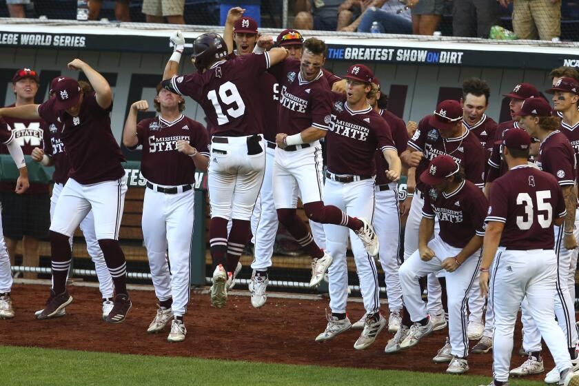 Mississippi State catcher Logan Tanner (19) celebrates after hitting a home run.