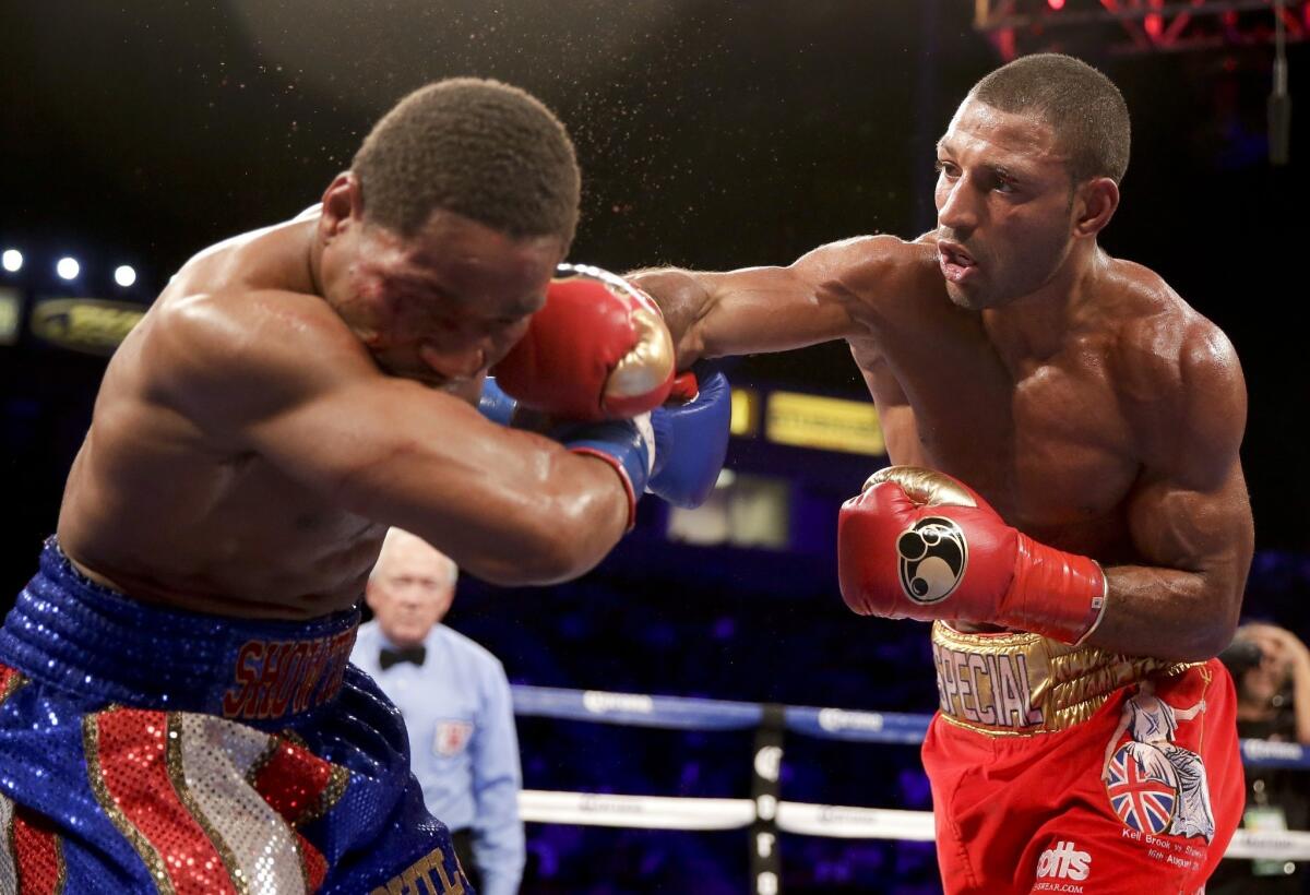Kell Brook, right, lands a punch on Shawn Porter during their IBF welterweight title fight in Carson at StubHub Center on Aug. 16. Kell was stabbed in the left leg Wednesday while on vacation on Spain's Tenerife.