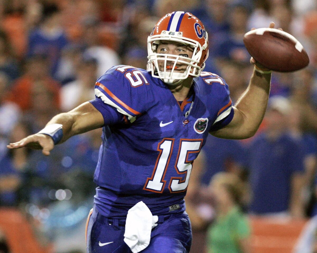 FILE - Florida quarterback Tim Tebow throws a pass during the first half of an NCAA college football game against LSU in Gainesville, Fla., Oct. 11, 2008. Tebow, who led Florida to two national championships and won a Heisman Trophy, is among the former players making their first appearance on the College Football Hall of Fame ballot this year. The National Football Foundation announced on Monday, June 6, 2022, the players and coaches eligible for election into the Hall of Fame, and 11 of the 80 FBS players will be debuting on the ballot. (AP Photo/John Raoux, File)