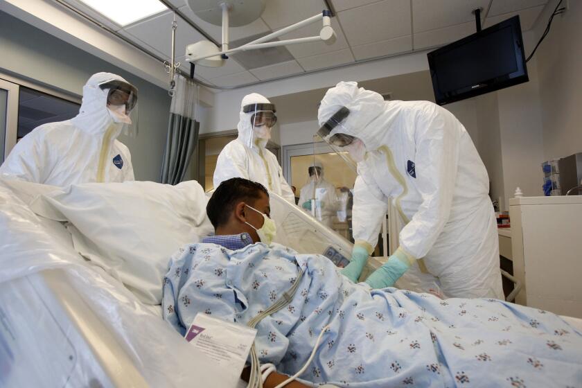 Doctors and staff at the Robald Reagan UCLA Medical Center participate in an Ebola preparedness exercise in October. UCLA's medical center was not among four in California identified Tuesday by federal officials as "Ebola treatment centers," but state officials expect it -- and three other hospitals in the southern part of the state -- to join the CDC list after scheduled inspections this week.