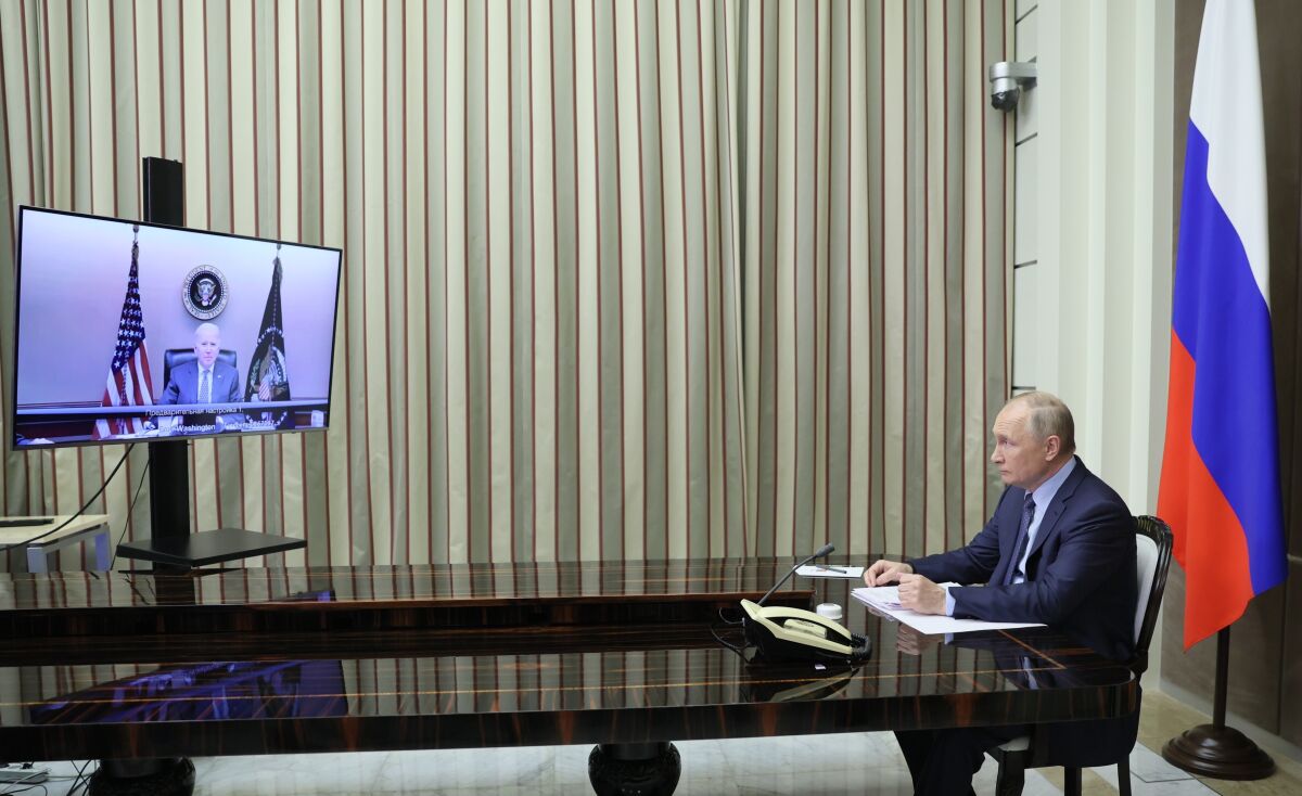 Russian President Vladimir Putin is shown during his talks with U.S. President Joe Biden via videoconference in the Bocharov Ruchei residence in the Black Sea resort of Sochi, Russia, Tuesday, Dec. 7, 2021. The video call between U.S. President Joe Biden and Russian President Vladimir Putin, during which the two leaders are expected to discuss tensions over Ukraine. (Mikhail Metzel, Sputnik, Kremlin Pool Photo via AP)
