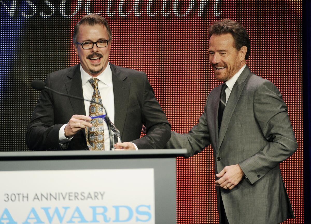 Vince Gilligan, left, creator and executive producer of the television series "Breaking Bad," and the show's star Bryan Cranston take the stage to accept the Program of the Year award at the 30th Annual Television Critics Assn. Awards Show at the Beverly Hilton on Saturday in Beverly Hills.