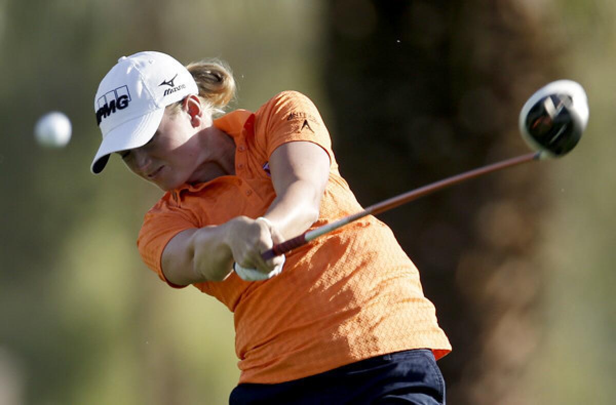 Stacy Lewis hits her drive at No. 11 during the first round of the Kraft Nabisco Championship on Thursday.