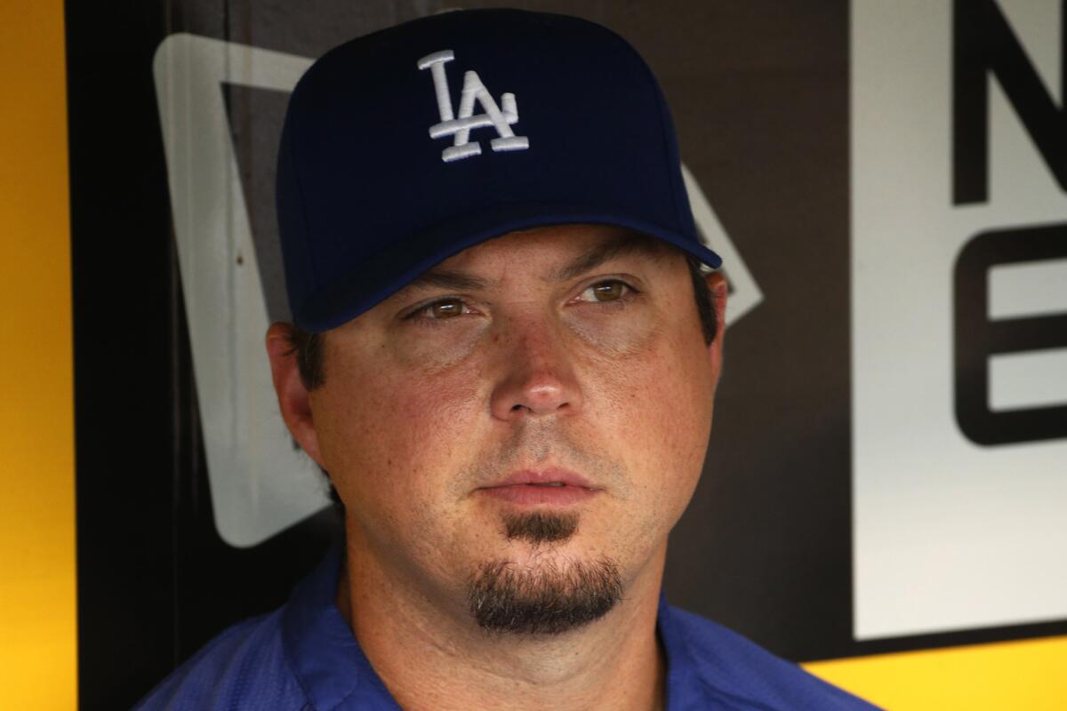 Dodgers pitcher Josh Beckett sits in the dugout before a game against the Pittsburgh Pirates on Monday.