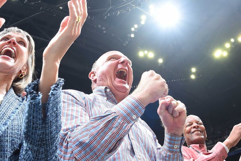Connie and Steve Ballmer cheer for the Clippers during a season-opening win over the Lakers in October.