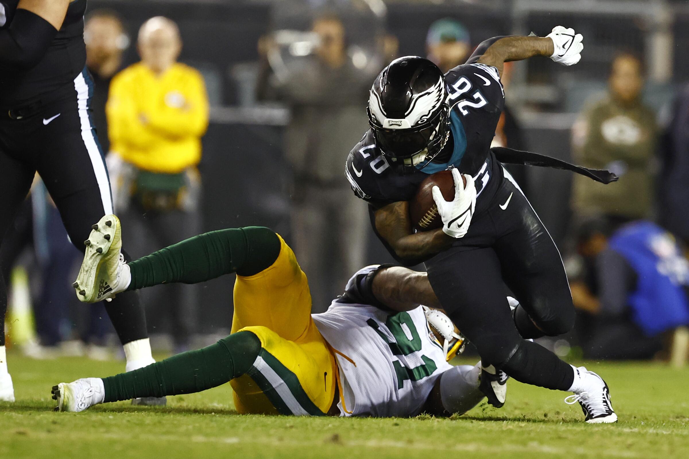 Philadelphia Eagles running back Miles Sanders in action against Green Bay Packers linebacker Preston Smith.