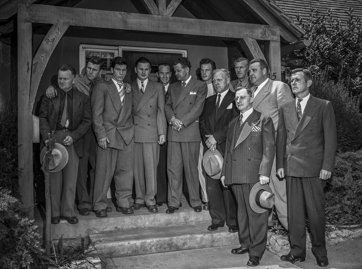 April 13, 1949: Some of the men who helped in the rescue effort attend the funeral for the 3-year-old.