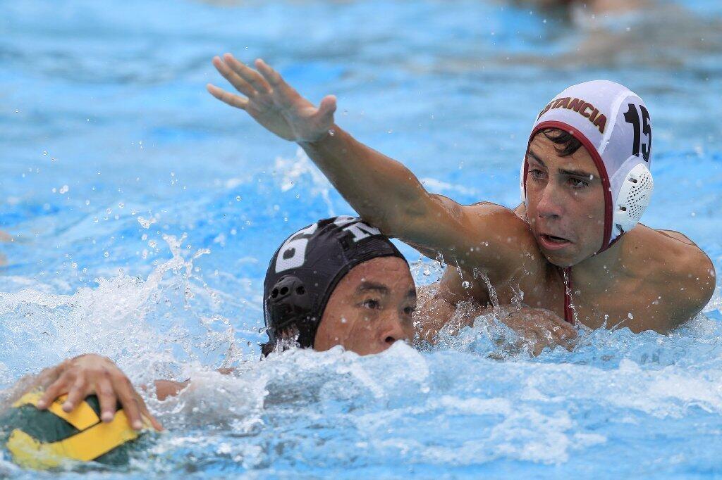 Estancia High's Kyle Fitzgerald, right, pressures Costa Mesa's Quinn Smith, left, during the first half in an Orange Coast League game on Wednesday.