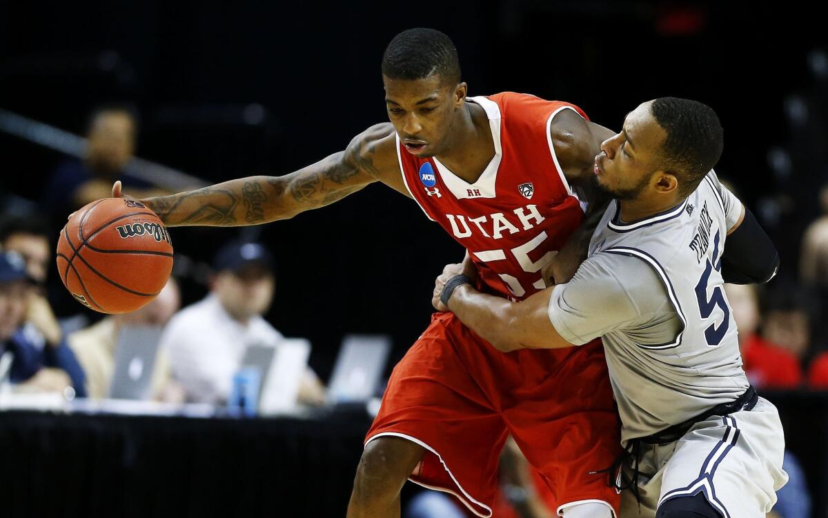 Utah's Delon Wright drives against Georgetown's Jabril Trawick during the Utes' 75-64 win Saturday.