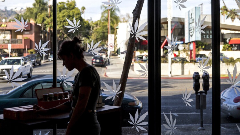 California legalized medical cannabis in 1996, and voters approved recreational use in 2016. Above, a woman peruses Medmen products in West Hollywood in 2017.