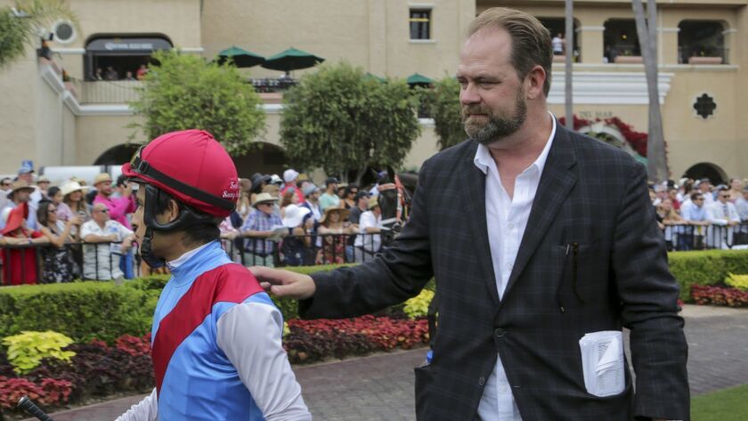 Trainer Doug O'Neill (right) and jockey Mario Gutierrez combined to win three races on opening day Wednesday at Del Mar.