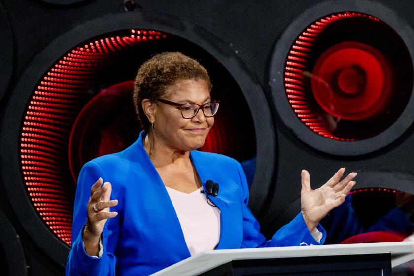 Los Angeles, CA - October 06: Los Angeles Mayoral candidates Congresswoman Karen Bass speaks as developer Rick Caruso, not pictured, listens, as they participate in the second one-on-one mayoral debate at the KNX Newsradio SoundSpace Stage in Los Angeles, Thursday, Oct. 6, 2022. (Allen J. Schaben / Los Angeles Times)