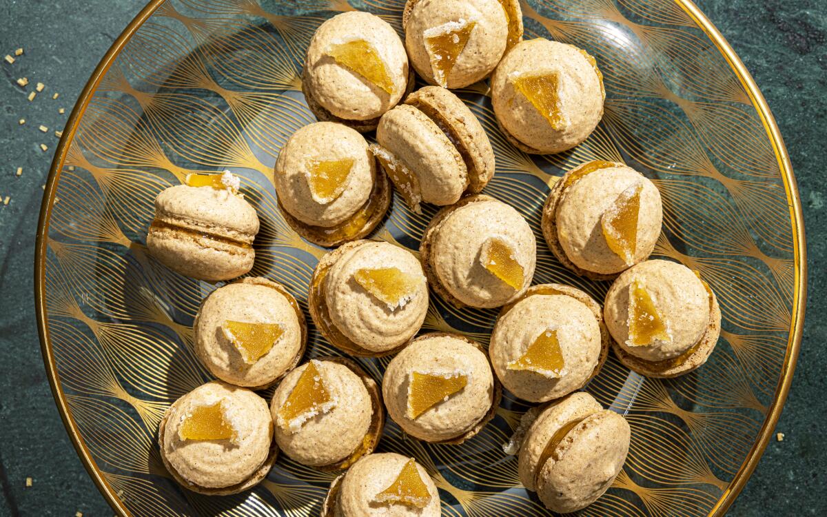 Gingerbread spices flavor these delicate, gluten-free macarons, perked up with bright Meyer lemon curd in the middle.