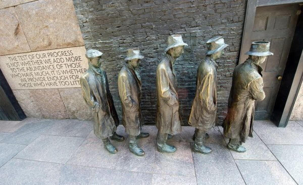Statues depicting men standing in a unemployment line during the Great Depression at the Franklin D. Roosevelt Memorial in Washington.