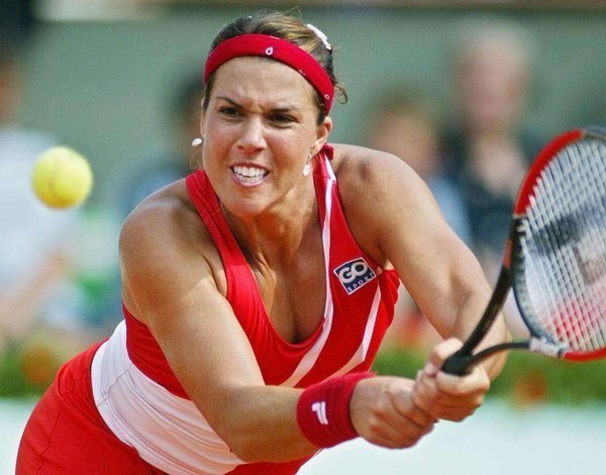 Jennifer Capriati, shown during the 2004 French Open, has been accused of several incidents involving battery and stalking her ex-boyfriend.