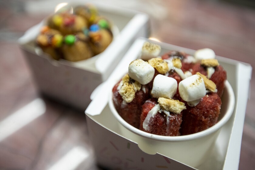 The smore red velvet, right, and the build your own churros from Churrino at Collage at South Coast Plaza.