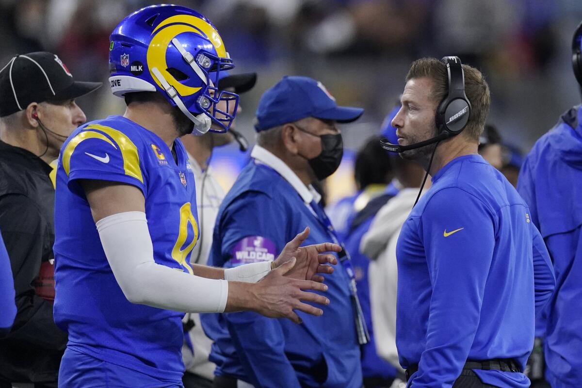 Rams quarterback Matthew Stafford talks with head coach Sean McVay.