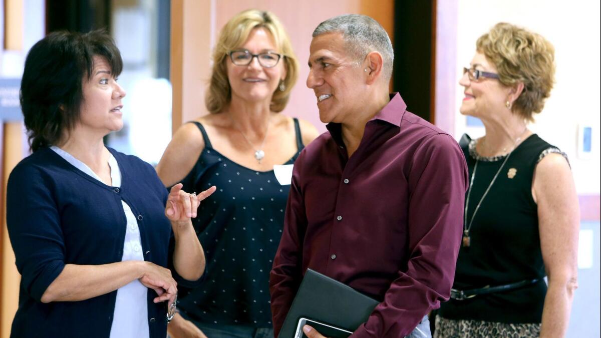 John Paramo, Burbank Unified's director of secondary education, shares a moment with others at a Burbank Arts for All Foundation event. He recently reported that 97% of Burbank Unified high school students graduated or earned a certificate of attendance.