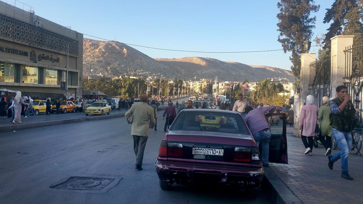 A busy thoroughfare near Damascus University.