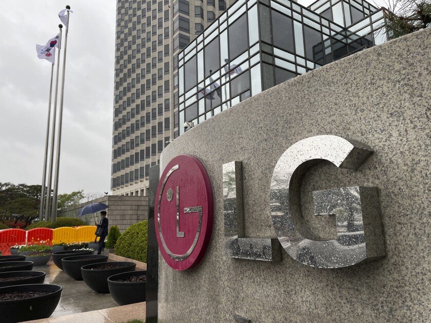 A logo of LG Electronics Inc. is seen outside of the company's office building in Seoul, South Korea, Monday, April 12, 2021. South Korean President Moon Jae-in on Monday welcomed a decision by two South Korean electric vehicle battery makers to settle a long-running intellectual property dispute that had threatened thousands of American jobs and President Joe Biden's environmental policies. (AP Photo/Ahn Young-joon)