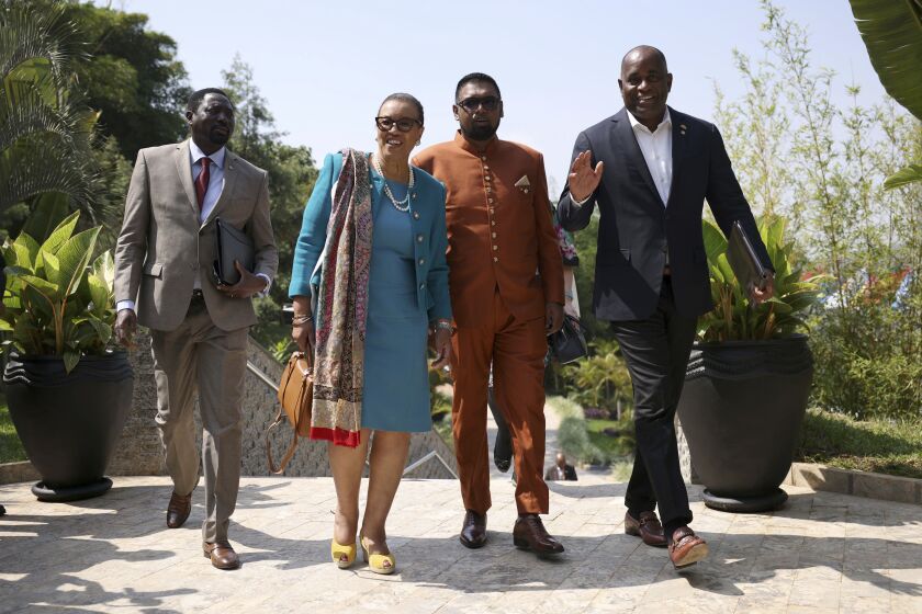 Secretary-General of the Commonwealth of Nations Patricia Scotland, second left, arrives for the Leaders' Retreat on the sidelines of the Commonwealth Heads of Government Meeting at Intare Conference Arena in Kigali, Rwanda, Saturday, June 25, 2022. (Dan Kitwood/Pool Photo via AP)